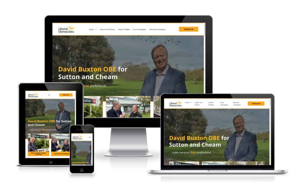 Various digital devices displaying the same political campaign website featuring a male candidate standing in a park.